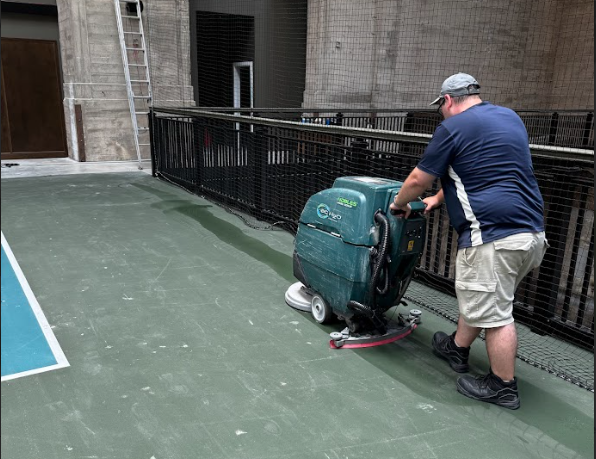 A person cleaning a floor with a machine
AI-generated content may be incorrect.