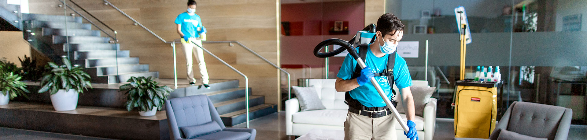 two servicemaster clean employees cleaning industrial building