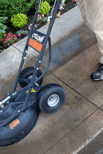 Washing a sidewalk